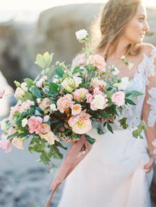 romantic beach wedding. plenty of petals florist