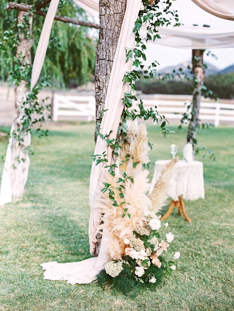 Chuppah inspiration, pampas grass. Calamigos Ranch wedding. Plenty of Petals florals. The Grovers Photography.