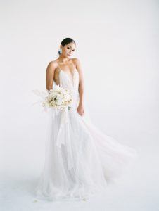 all white wedding inspiration. luna de mare photo, plenty of petals